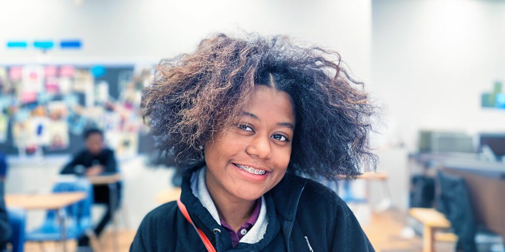 Student smiling in class