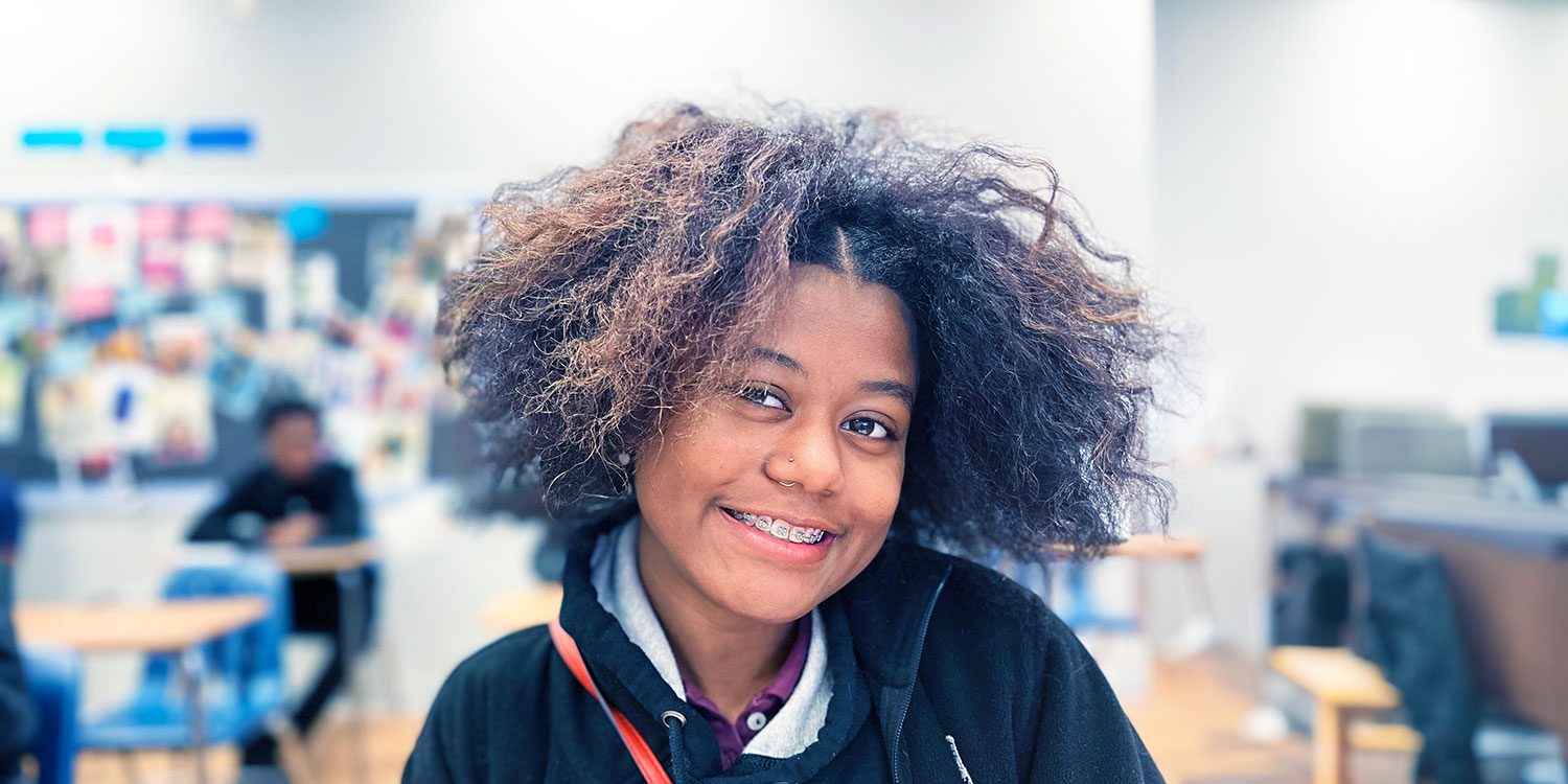 Student smiling in class